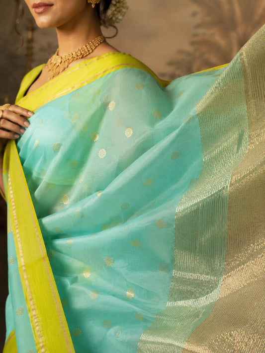 Turquoise Blue-green Chanderi Saree with bright green border and floral motifs