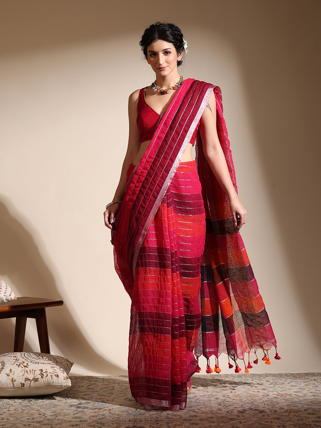 Multi-colored linen saree with silver zari interlacing