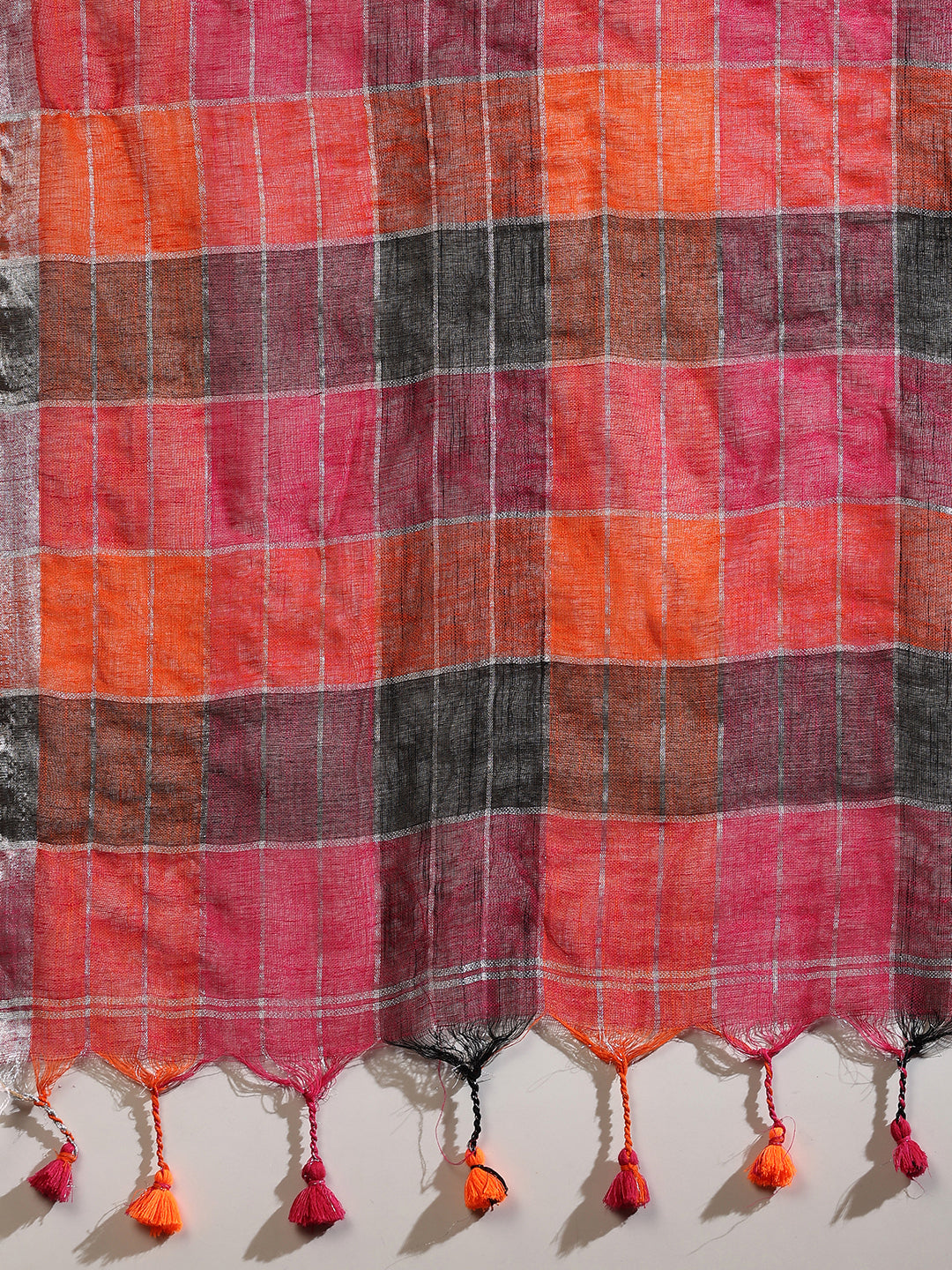 Multi-colored linen saree with silver zari interlacing