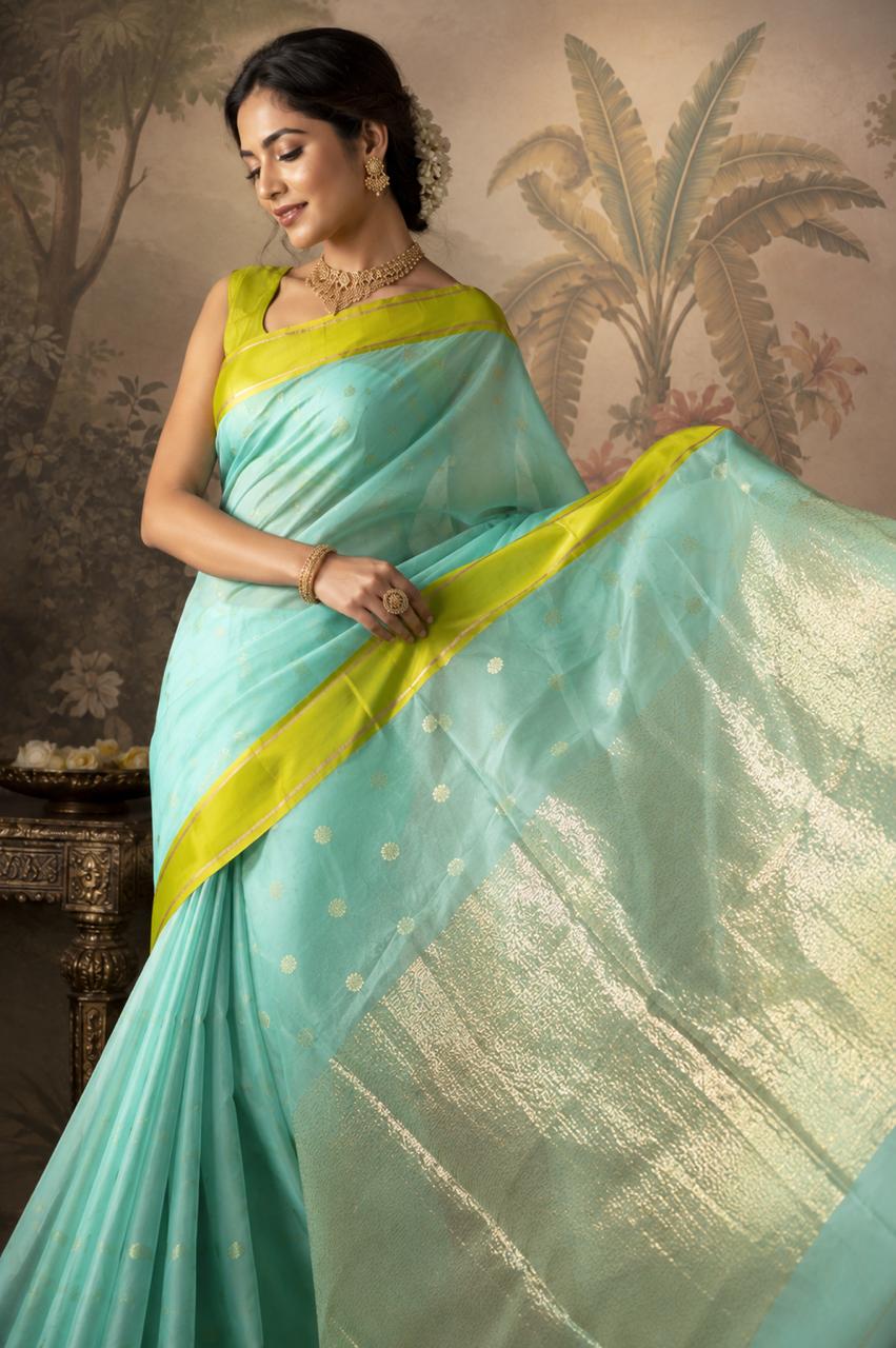 Turquoise Blue-green Chanderi Saree with bright green border and floral motifs