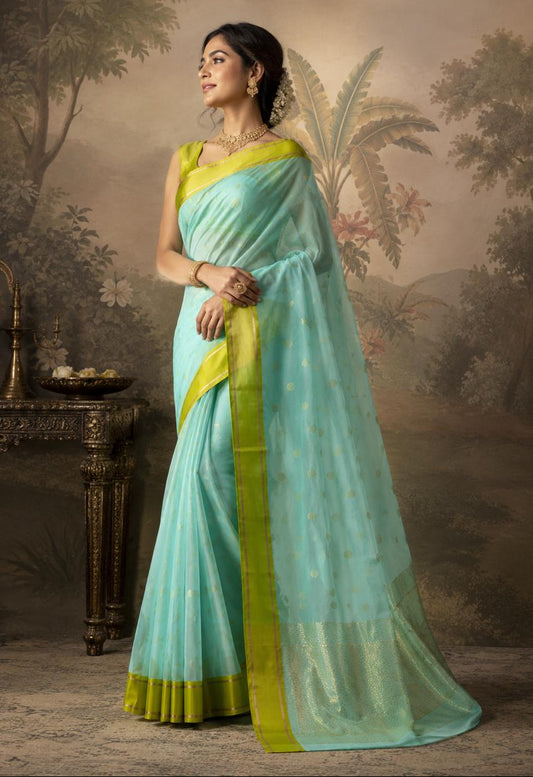 Turquoise Blue-green Chanderi Saree with bright green border and floral motifs